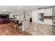 Bright kitchen with stainless steel appliances, an island, and hardwood floors at 4605 Heathcliff Way, Cumming, GA 30041