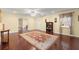 Large living room with hardwood flooring, ample light, and space for entertaining at 4605 Heathcliff Way, Cumming, GA 30041