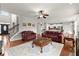 Open-concept living room leading to the kitchen, with stylish decor and hardwood floors at 4605 Heathcliff Way, Cumming, GA 30041