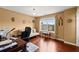 Office with hardwood floors, desk, futon, and natural light at 4605 Heathcliff Way, Cumming, GA 30041