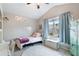 Cozy bedroom with natural light, plush carpet, and blue curtain accents at 6065 Falls Landing Dr, Cumming, GA 30040
