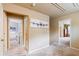 Hallway showing the entrance to the bedroom with neutral colored walls and carpet at 6065 Falls Landing Dr, Cumming, GA 30040