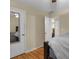 This bedroom features wood floors, neutral walls, and a white door with a mirror at 10 Mcgiboney Pl, Covington, GA 30016