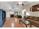 Spacious living room features a vaulted ceiling, fireplace, and hardwood floors at 10 Mcgiboney Pl, Covington, GA 30016