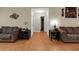 Open living room features hardwood floors, neutral colors, and access to hallways at 10 Mcgiboney Pl, Covington, GA 30016