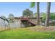 Backyard with a house, large trees, new fence, raised garden beds, and lush lawn at 2193 Cloverdale Se Dr, Atlanta, GA 30316