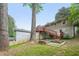Backyard featuring a stone exterior, large trees, a new fence, and raised garden beds at 2193 Cloverdale Se Dr, Atlanta, GA 30316