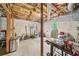 Unfinished basement with exposed beams, concrete floor, tools, and outside access at 2193 Cloverdale Se Dr, Atlanta, GA 30316