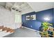 Unique basement space with painted brick accent walls, modern art, and ample lighting at 2193 Cloverdale Se Dr, Atlanta, GA 30316