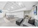 Finished basement with a ping pong table, seating area, and white painted brick walls at 2193 Cloverdale Se Dr, Atlanta, GA 30316