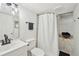 Bathroom featuring marble-tiled shower, black hardware, and a basket for towels at 2193 Cloverdale Se Dr, Atlanta, GA 30316