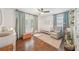 Bright Bedroom featuring hardwood floors, neutral walls, a ceiling fan, and ample natural light at 2193 Cloverdale Se Dr, Atlanta, GA 30316