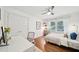 Cozy bedroom featuring hardwood floors, a bright window, and a modern desk area at 2193 Cloverdale Se Dr, Atlanta, GA 30316