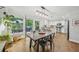Cozy dining area with access to the outdoor deck and modern lighting at 2193 Cloverdale Se Dr, Atlanta, GA 30316