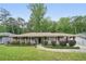 Inviting ranch-style home featuring a brick facade and landscaped front yard at 2193 Cloverdale Se Dr, Atlanta, GA 30316