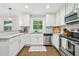 Bright kitchen boasts granite counters, stainless steel appliances, and hardwood floors at 2193 Cloverdale Se Dr, Atlanta, GA 30316