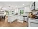Bright kitchen boasts granite counters, stainless steel appliances, and hardwood floors at 2193 Cloverdale Se Dr, Atlanta, GA 30316