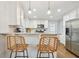 Modern kitchen featuring white cabinets, stainless steel appliances, and hardwood floors at 2193 Cloverdale Se Dr, Atlanta, GA 30316
