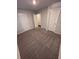 Spacious carpeted bedroom featuring two closets and neutral colored walls at 30 Barton Ln, Covington, GA 30016