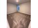 Clean bedroom with neutral carpet and a window, ready for personal touches at 30 Barton Ln, Covington, GA 30016