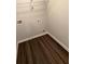Utility room featuring hookups, modern floors and overhead storage at 30 Barton Ln, Covington, GA 30016