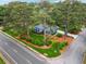 Aerial view of a home showcasing its manicured lawn, mature trees, and proximity to the street at 3772 Evans Rd, Atlanta, GA 30340