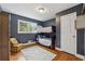 Cozy bedroom with a bunk bed, hardwood floors, and a chair at 3772 Evans Rd, Atlanta, GA 30340