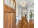 Inviting entryway featuring hardwood floors that lead into a bright kitchen at 3772 Evans Rd, Atlanta, GA 30340
