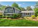 Two-story home exhibits mature landscaping, lawn, and a charming exterior at 3772 Evans Rd, Atlanta, GA 30340