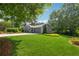 Charming home exterior with a well-manicured lawn and mature trees at 3772 Evans Rd, Atlanta, GA 30340