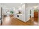 Open concept kitchen with white cabinets, stainless steel appliances and hardwood floors at 3772 Evans Rd, Atlanta, GA 30340