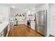 Bright kitchen features stainless steel appliances, hardwood floors, and white cabinetry at 3772 Evans Rd, Atlanta, GA 30340