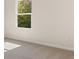 Bright bedroom featuring neutral carpet and ample light from a single window at 8230 Coldstream Dr, Fairburn, GA 30213