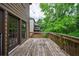 Spacious wooden deck perfect for outdoor dining and entertaining, featuring a view of the lush backyard at 1523 Fallen Leaf Dr, Marietta, GA 30064