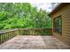 Wooden deck featuring a serene outdoor view, ideal for outdoor relaxation and entertaining with views of nature at 1523 Fallen Leaf Dr, Marietta, GA 30064