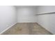 Clean basement featuring carpet flooring and a shelf for added storage space at 1523 Fallen Leaf Dr, Marietta, GA 30064