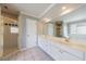 Bright bathroom featuring a walk-in shower, tile floors, and dual sink vanity at 1523 Fallen Leaf Dr, Marietta, GA 30064