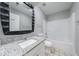 Updated bathroom with granite countertop, modern fixtures, and bathtub-shower combo at 1523 Fallen Leaf Dr, Marietta, GA 30064