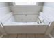 A close up of a clean, well-maintained built-in bathtub at 1523 Fallen Leaf Dr, Marietta, GA 30064
