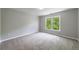 Bedroom with carpet flooring and natural light from a window at 1523 Fallen Leaf Dr, Marietta, GA 30064