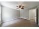 Neutral bedroom with light grey walls, ceiling fan, and plush carpeting throughout at 1523 Fallen Leaf Dr, Marietta, GA 30064