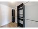 Walk-in closet with extensive dark wood shelving and rods for ample storage and organization at 1523 Fallen Leaf Dr, Marietta, GA 30064