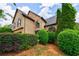 Stunning home exterior boasts stone accents, manicured landscaping, and charming architectural details at 1523 Fallen Leaf Dr, Marietta, GA 30064