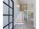 Inviting foyer features an open staircase, high ceilings, and sleek wood flooring at 1523 Fallen Leaf Dr, Marietta, GA 30064