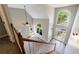A foyer showcases soaring ceilings, arched windows, and staircase with wood railing at 1523 Fallen Leaf Dr, Marietta, GA 30064