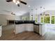 Open kitchen featuring stainless appliances, black countertops, with a view of an adjacent seating area and fireplace at 1523 Fallen Leaf Dr, Marietta, GA 30064