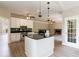 Well-lit kitchen features an island, sleek black countertops, and modern appliances at 1523 Fallen Leaf Dr, Marietta, GA 30064