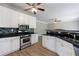 Modern kitchen featuring stainless appliances, white cabinets, granite countertops, with an open design at 1523 Fallen Leaf Dr, Marietta, GA 30064