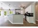Spacious open concept kitchen with a center island, white cabinets, stainless steel appliances, and wood floors at 1523 Fallen Leaf Dr, Marietta, GA 30064