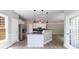 Bright kitchen with island, stainless steel appliances, and modern pendant lighting at 1523 Fallen Leaf Dr, Marietta, GA 30064